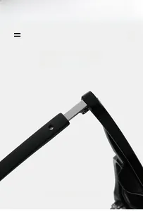 Detail of durable metal hinges on lightweight matte black sunglasses frame
