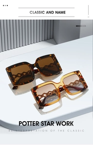 Close-up of retro square sunglasses with tortoiseshell frames and gold chain temples