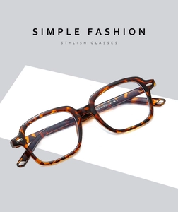 Macro view of tortoise shell frame glasses showing detailed size specs and CE mark