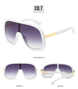 Detail view of white wrap-around sunglasses with gradient purple lenses and gold metal hinge