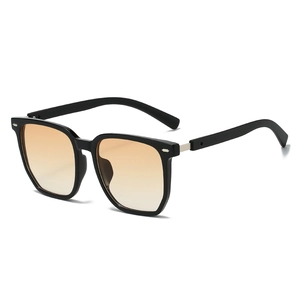 Fashionable black square oversized sunglasses with orange gradient lenses and metal trim