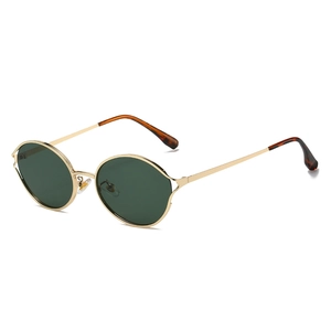 Retro round metal sunglasses with dark green lenses and gold frame on white background