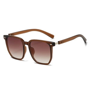 Fashionable square sunglasses with transparent brown frames and gradient lenses on white backdrop