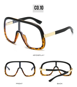 Detailed views of oversized flat top sunglasses with tortoiseshell accents and gold metal trim