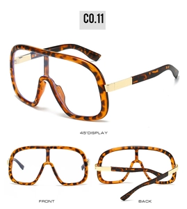 Three views of oversized tortoiseshell shield sunglasses with gold metal temples