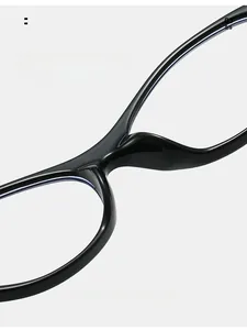 Macro shot of ergonomic integrated nose pads on ultra-light black eyeglasses frames