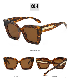 Detailansicht der Retro-Cateye-Sonnenbrille mit goldfarbenem Flechtmuster am Bügel