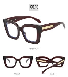 Detailansicht der dunkelroten Cat-Eye-Sonnenbrille mit goldenen Rautenmustern