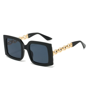 Classic oversized square sunglasses with black frame and gold chain metal temples