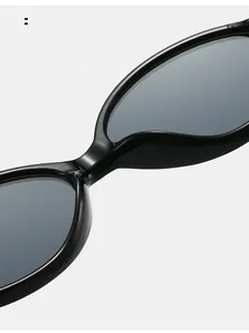 Detail view of smooth integrated nose pads on black oval sunglasses for comfort