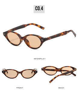 Vue détaillée de lunettes de soleil ovales en écaille avec verres teintés orange