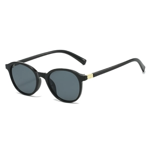 Lunettes de soleil rondes rétro noir brillant avec verres gris et rivets métalliques dorés