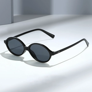 Retro minimalist oval black sunglasses with double rivet hinges and UV protection