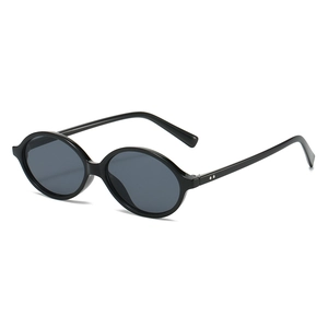 Vintage oval black sunglasses with small frame and UV protection in minimalist retro style