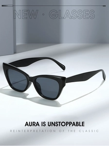 Close-up of stylish black cat-eye sunglasses with glossy frames and dark lenses