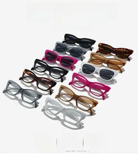 Flat lay of cat-eye and square sunglasses in various colors including black and tortoise