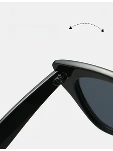 Close-up of durable metal reinforced hinge on glossy black cat-eye sunglasses