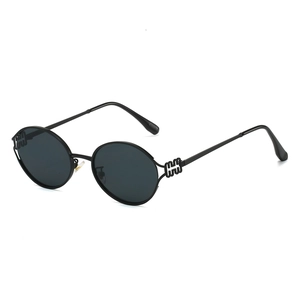 Retro round frame black metal sunglasses with geometric hollow temple design for women