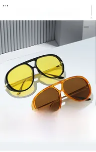 Detail of pilot sunglasses with yellow and tortoiseshell lenses and gold metal temples