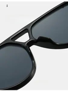 Macro detail of ergonomic black sunglasses frame showing comfortable integrated nose pads