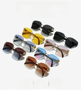 Detail view of frameless square sunglasses with gold metal bridge in multiple gradient colors