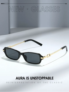 Detail view of square black sunglasses with golden metal temples and hollow out design