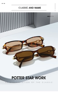 Detail of tortoise shell sunglasses with gold metal accents and brown lenses