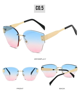 Detail view of rimless sunglasses with blue-pink gradient lenses and gold frames