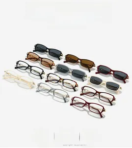 Detail of vintage rectangular sunglasses with golden metal hollow buckle on the temple