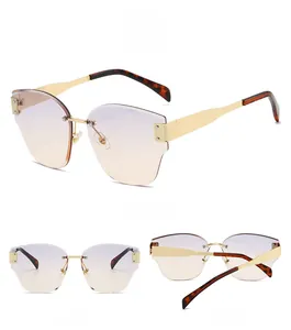 Three views of rimless cat-eye sunglasses with purple gradient lenses and gold metal frames