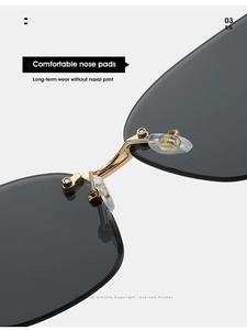 Close-up of golden metal bridge and soft silicone nose pads on rimless sunglasses
