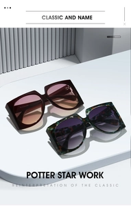 Detail of oversized retro sunglasses in glossy burgundy and tortoiseshell finishes