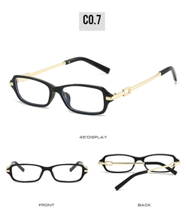 Detail view of rectangular black frame sunglasses with golden metal hollowed hinges