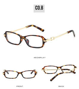 Detail of tortoise shell frame and gold metal temples with geometric hollow design