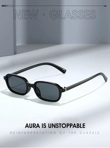 Detail view of stylish black square sunglasses with polished frames and dark grey lenses