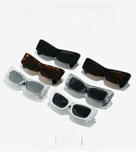 Detailed close-up of colorful rectangle sunglasses in black, white, and tortoiseshell