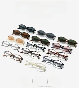 Detailed flat lay of oval frame retro sunglasses in various colors with heart temples