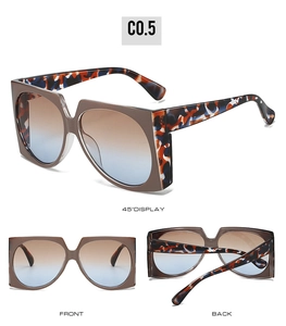 Detail view of large square sunglasses in coffee frame with blue-orange tortoise temples