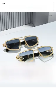 Detail of luxury geometric gold metal sunglasses with tiered temples and gradient lenses