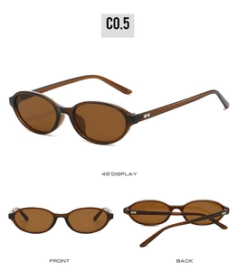 Detailed views of oval amber sunglasses with vintage heart metal accents on temples