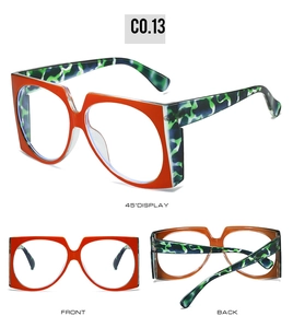 Detail view of large square orange sunglasses with blue leopard print temples C0.13