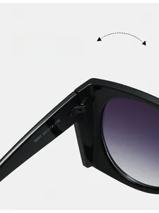 Macro view of durable metal hinge and purple gradient lens on black oversized sunglasses