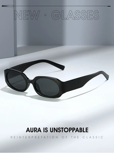 Detail view of bold black rectangular sunglasses featuring thick frames and sleek design
