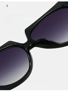 Detail of comfortable integrated nose pads on large black frame sunglasses with gradient lens