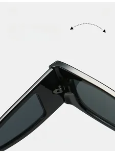 Close-up of durable metal hinge on black small frame square sunglasses with glossy finish