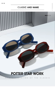 Close-up of retro rectangular sunglasses in deep blue and wine red on a minimalist display