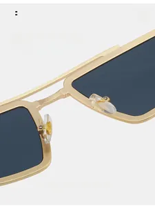 Detail of comfortable nose pads on vintage gold luxury sunglasses with square frame