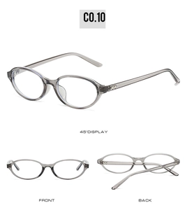 Detail view of oval grey sunglasses featuring metallic heart accents on the temples