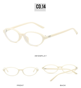 Macro detail of cream oval glasses featuring silver heart-shaped metal temple accents