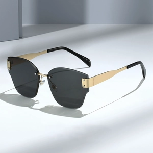 Frameless oversized geometric sunglasses with dark grey lenses and gold metal temples